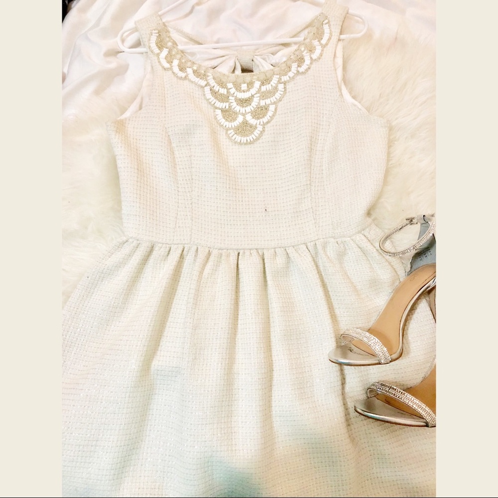 Beaded white cocktail dress with silver details